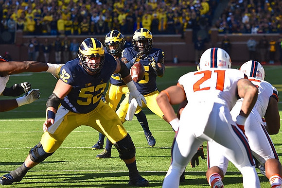 Mason Cole (52) and Jabrill Peppers (5)