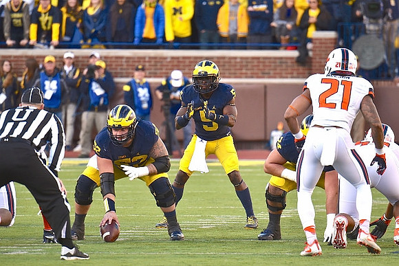 Mason Cole (52), Jabrill Peppers (5), and Ben Bredeson (74)
