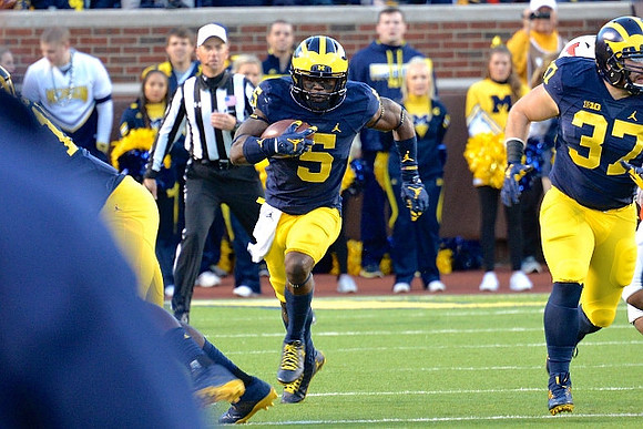 Jabrill Peppers (5) and Bobby Henderson (37)