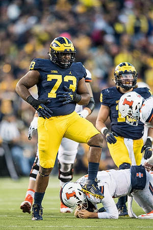 Maurice Hurst (73) and Chase Winovich (15)