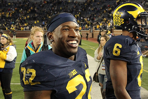 Karan Higdon (22) and Keith Washington (6)