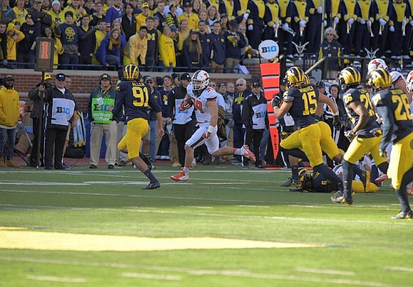 Kenny Allen (91), Chase Winovich (15), Jourdan Lewis (26), and Brandon Watson (28)