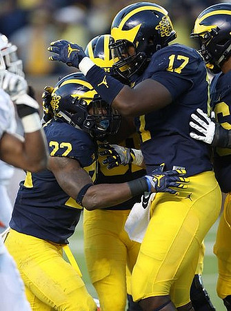 Karan Higdon (22) and Tyrone Wheatley Jr. (17)