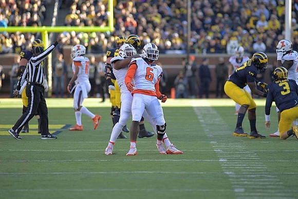 Mason Cole (52), Kyle Kalis (67), Tyrone Wheatley Jr. (17), and Wilton Speight (3)