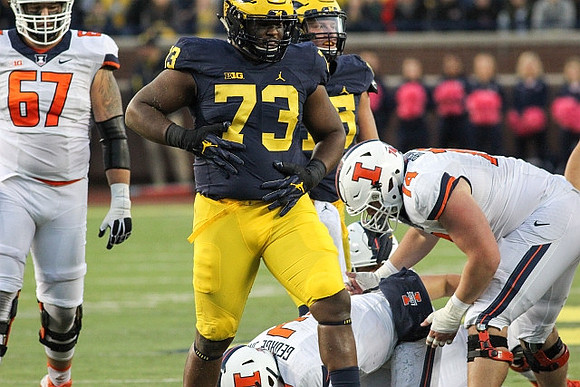 Maurice Hurst (73) and Chase Winovich (15)