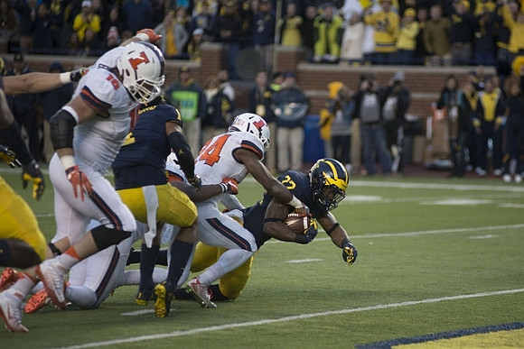 Kekoa Crawford (1) and Karan Higdon (22)