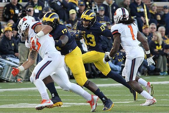 Tyrone Wheatley Jr. (17) and Eddie McDoom (13)
