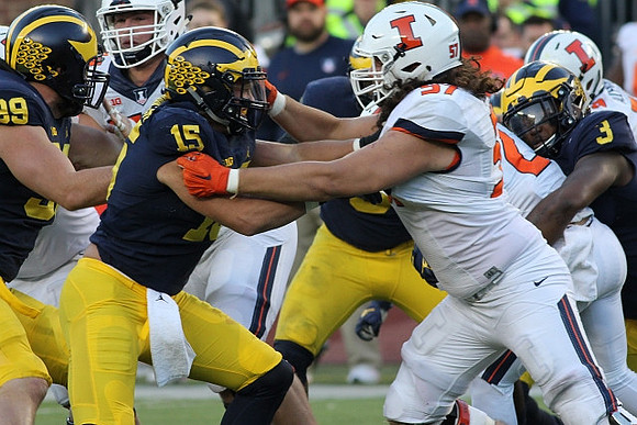 Matthew Godin (99), Chase Winovich (15), and Rashan Gary (3)