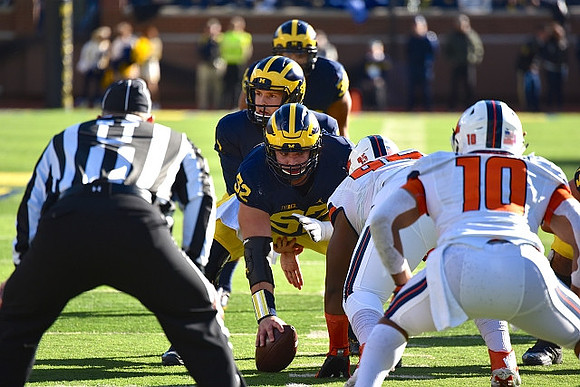 Mason Cole (52), Wilton Speight (3), and Ty Isaac (32)