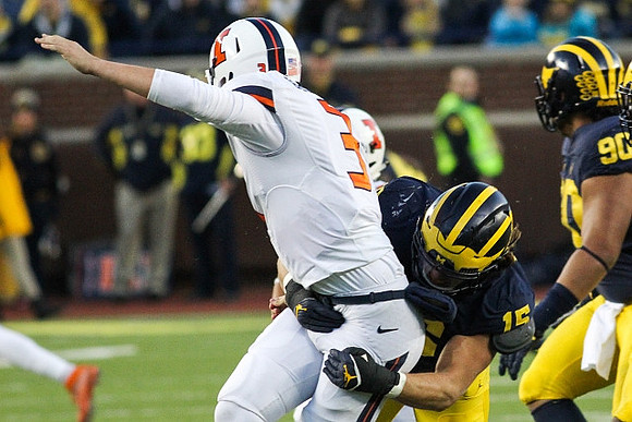 Chase Winovich (15) and Bryan Mone (90)