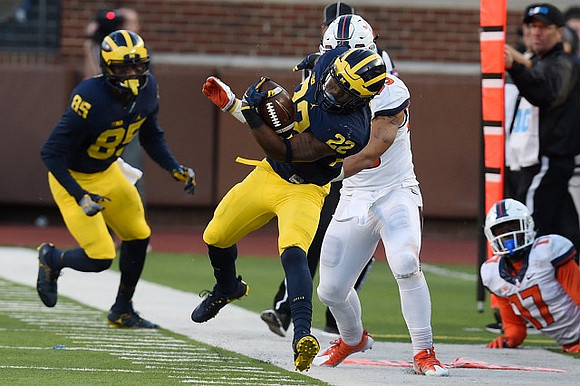 Maurice Ways (85) and Karan Higdon (22)