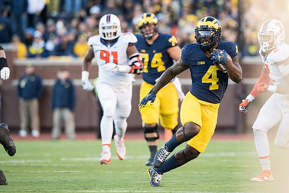 Ben Bredeson (74) and De'Veon Smith (4)