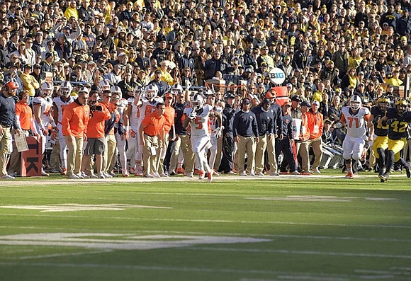 Chase Winovich (15) and Ben Gedeon (42)