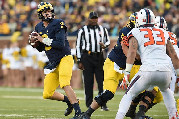 Wilton Speight (3) and Mason Cole (52)