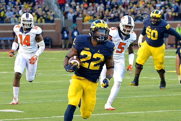 Karan Higdon (22) and Michael Onwenu (50)
