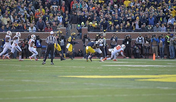 Erik Magnuson (78), Khalid Hill (80), and De'Veon Smith (4)