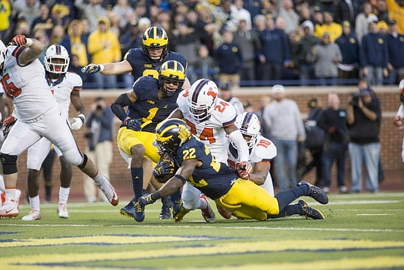 James Foug (31), Kekoa Crawford (1), and Karan Higdon (22)