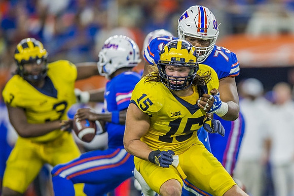 Rashan Gary (3) and Chase Winovich (15)
