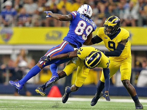 Lavert Hill (24) and Mike McCray (9)