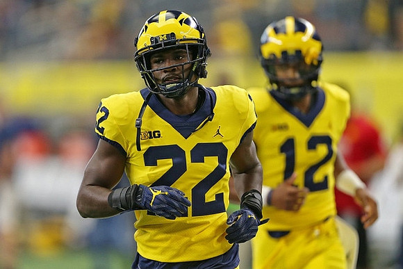 Karan Higdon (22) and Chris Evans (12)