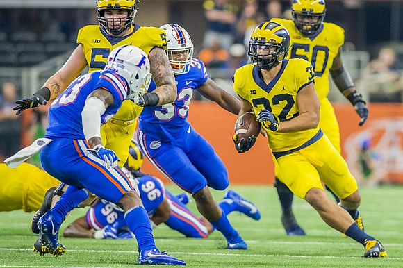 Michael Onwenu (50) and Karan Higdon (22)