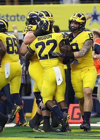 Maurice Ways (85), Mason Cole (52), Karan Higdon (22), and Kekoa Crawford (1)