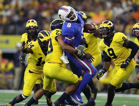 Josh Metellus (14), Tyree Kinnel (23), and Mike McCray (9)