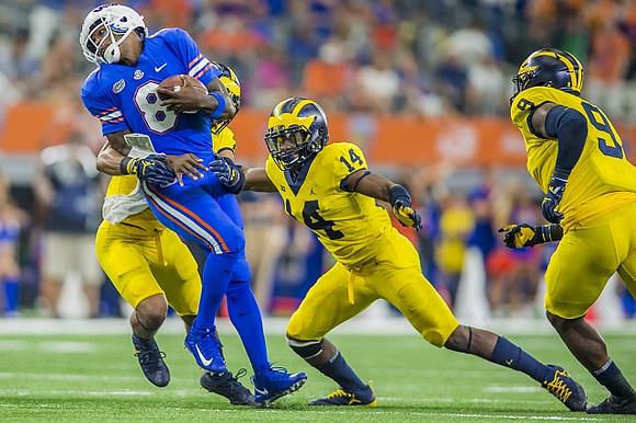 Josh Metellus (14) and Mike McCray (9)