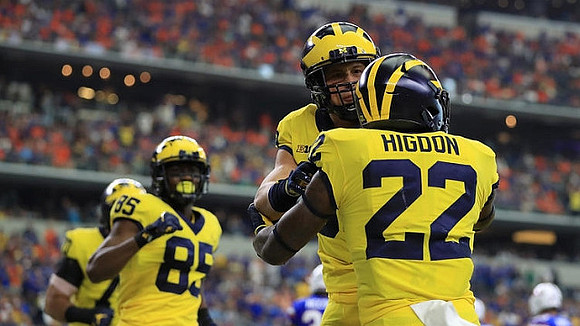 Maurice Ways (85) and Karan Higdon (22)