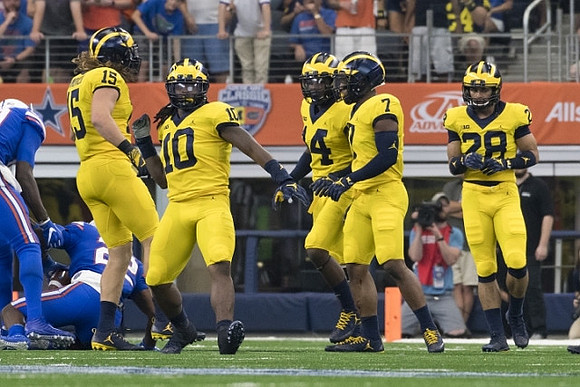 Chase Winovich (15), Devin Bush (10), Josh Metellus (14), Khaleke Hudson (7), and Brandon Watson (28)