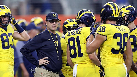 Zach Gentry (83), Jim Harbaugh, Nate Schoenle (81), and Joseph Files (38)
