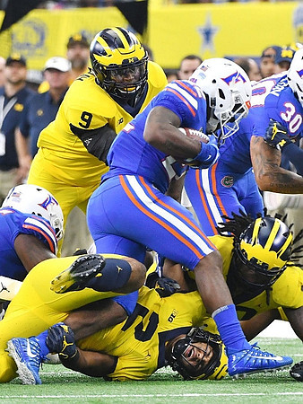Mike McCray (9), Carlo Kemp (2), and Devin Bush (10)