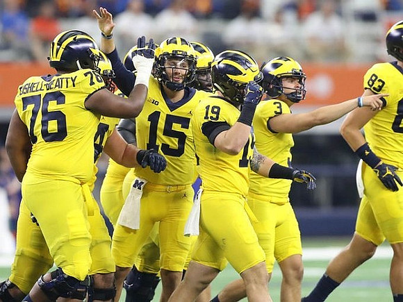 Juwann Bushell-Beatty (76), Garrett Moores (15), Henry Poggi (19), Quinn Nordin (3), and Zach Gentry (83)