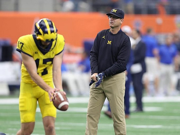 Will Hart (17) and Jim Harbaugh
