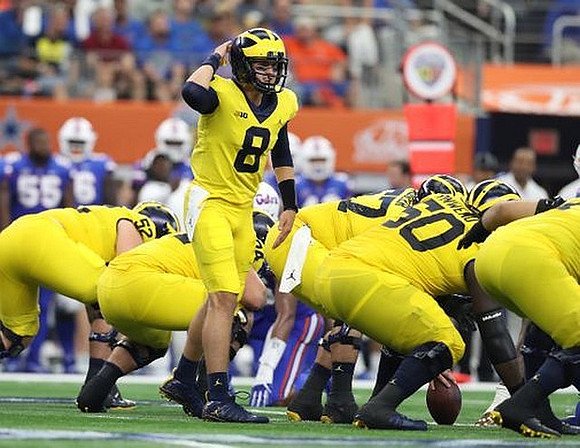 Mason Cole (52), John O'Korn (8), Patrick Kugler (57), and Michael Onwenu (50)