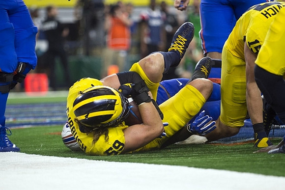 Noah Furbush (59) and Chase Winovich (15)