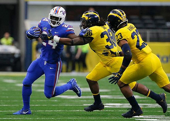 Devin Gil (36) and Tyree Kinnel (23)