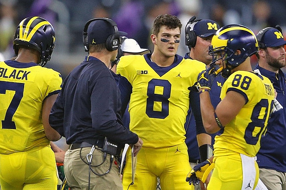 Tarik Black (7), Jim Harbaugh, John O'Korn (8), and Grant Perry (88)