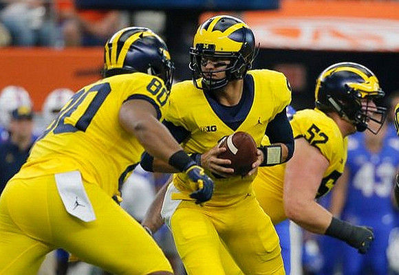 Khalid Hill (80), John O'Korn (8), and Mason Cole (52)