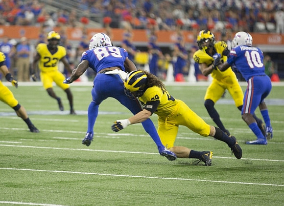 Tyree Kinnel (23), Brandon Watson (28), and J'Marick Woods (26)