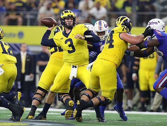 Chris Evans (12), Wilton Speight (3), and Ben Bredeson (74)