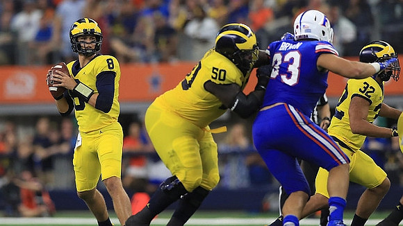 John O'Korn (8), Michael Onwenu (50), and Ty Isaac (32)