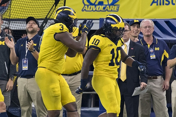 Rashan Gary (3) and Devin Bush (10)