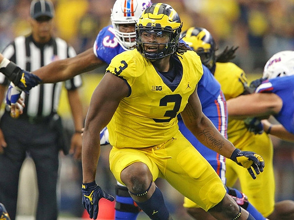 Rashan Gary (3) and Devin Bush (10)