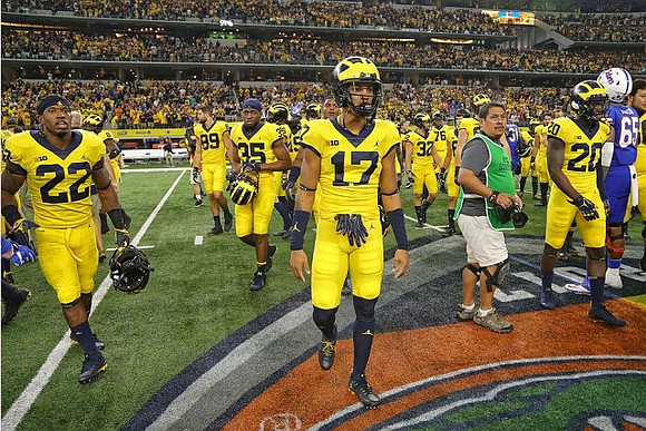 Karan Higdon (22), Tyrone Wheatley Jr. (17), and Tru Wilson (20)