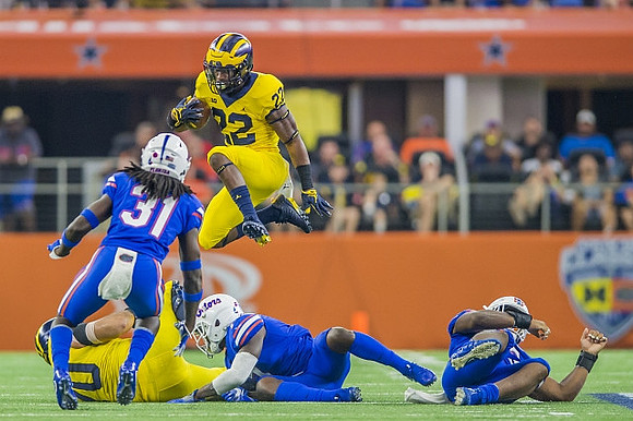 Nolan Ulizio (70) and Karan Higdon (22)
