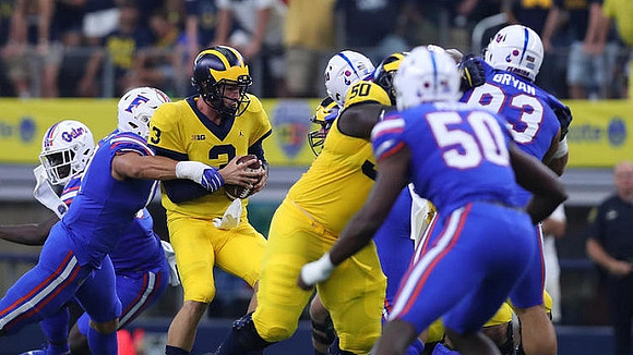 Wilton Speight (3) and Michael Onwenu (50)