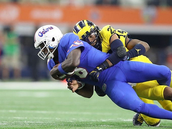 Tyree Kinnel (23) and Josh Metellus (14)