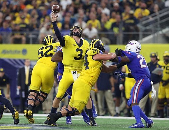 Mason Cole (52), Wilton Speight (3), and Ben Bredeson (74)