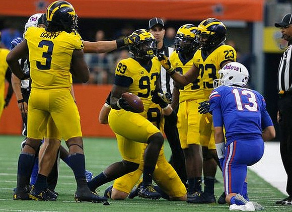 Rashan Gary (3), Lawrence Marshall (93), and Tyree Kinnel (23)
